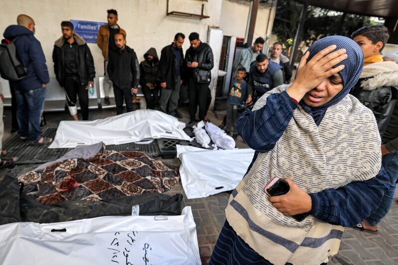A woman grieves beside the bodies of Palestinians killed overnight during Israeli bombardment of Rafah in the southern Gaza Strip. Photograph: Mohammed Abed/AFP/Getty
