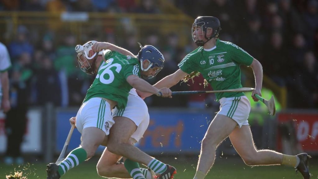 Naomh Éanna’s Tom Stafford and Charlie McGurkin try to tackle Michael Fennelly of Ballyhale Shamrocks. Photo: Bryan Keane/Inpho