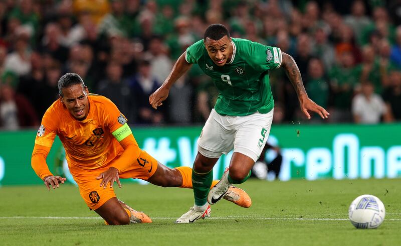 Virgil van Dijk of The Netherlands with Adam Idah of Ireland. Photograph: Ryan Byrne/Inpho