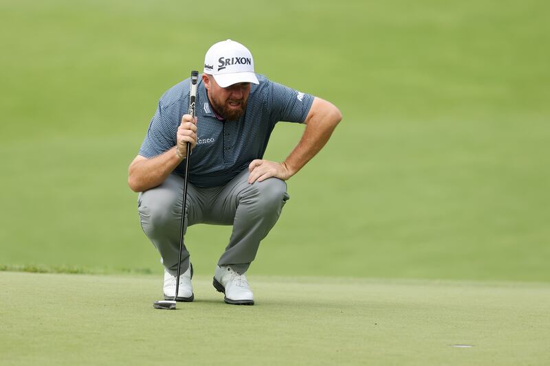 Shane Lowry of Ireland lines up a putt on the second green. Photograph: Michael Reaves/Getty
