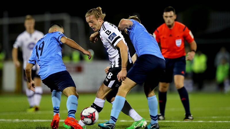 Dundalk’s John Mountney is challenged by Greg Sloggett and Conor Davies of UCD. during the FAI Cup semi-final at Oriel Park. Photograph: Ryan Byrne/Inpho