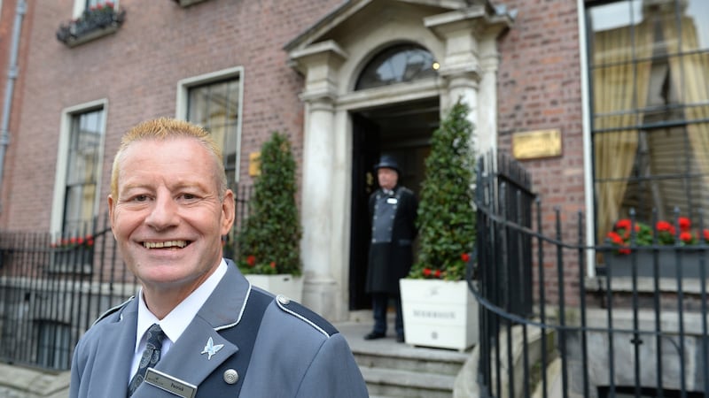 Patrick Kelly, a concierge and porter, at The Merrion Hotel Dublin. Kelly has worked at the hotel since it opened 20 years ago. Photograph: Dara Mac Dónaill