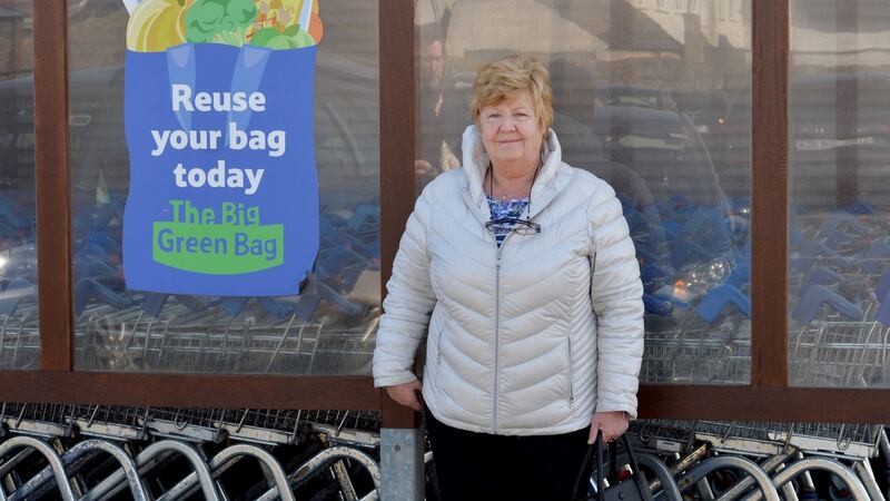 Alison Carton queueing to shop. “We had painters around for one day but then the guards told them they couldn’t come back because it wasn’t urgent.” Photograph: Alan Betson