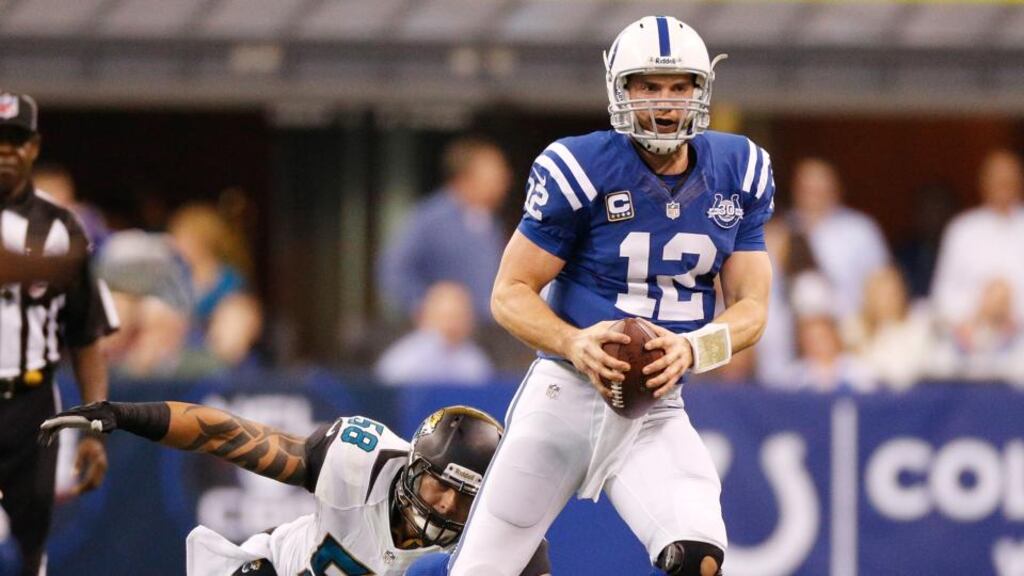 Andrew Luck of the Indianapolis Colts outruns the tackle of Jason Babin of the Jacksonville Jaguars during the second quarter at Lucas Oil Stadium on December 29th in Indianapolis, Indiana. Photograph: Gregory Shamus/Getty Images