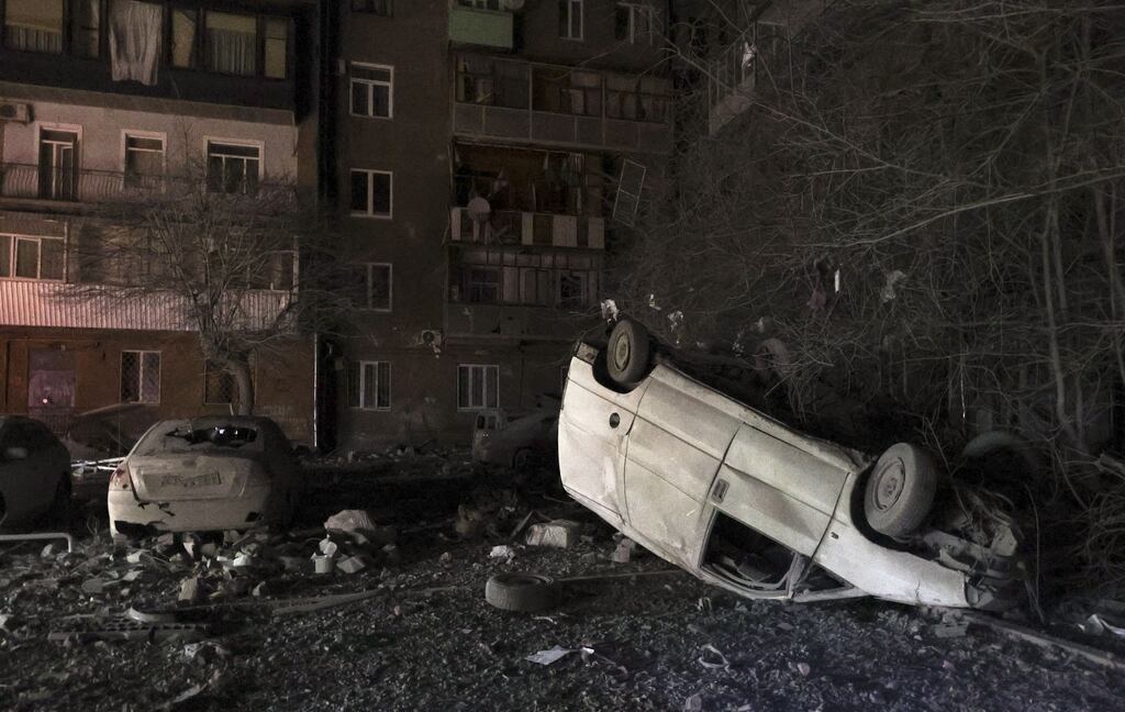 Damaged vehicles following an overnight shelling in Kharkiv, eastern Ukraine, on Friday, amid the Russian invasion. At least one person was injured as a result of the attack. Photograph: Sergey Kozlov/EPA