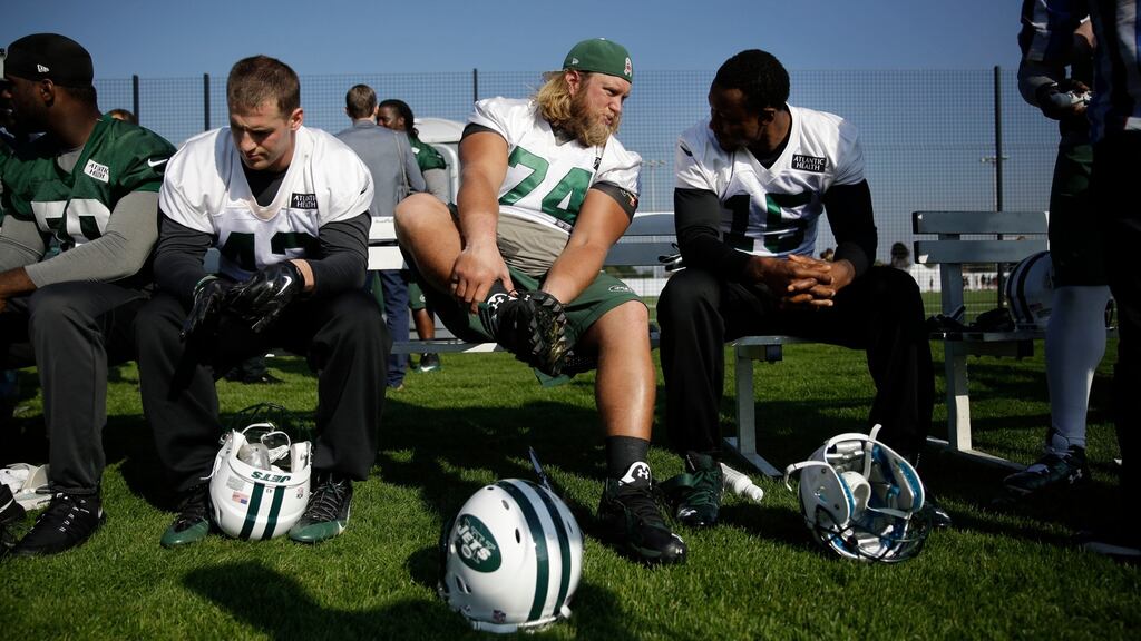 New York Jets center Nick Mangold (centre), and wide receiver Brandon Marshall (right) chat at the end of an NFL training session at London Irish training ground in south west London. Photograph: AP