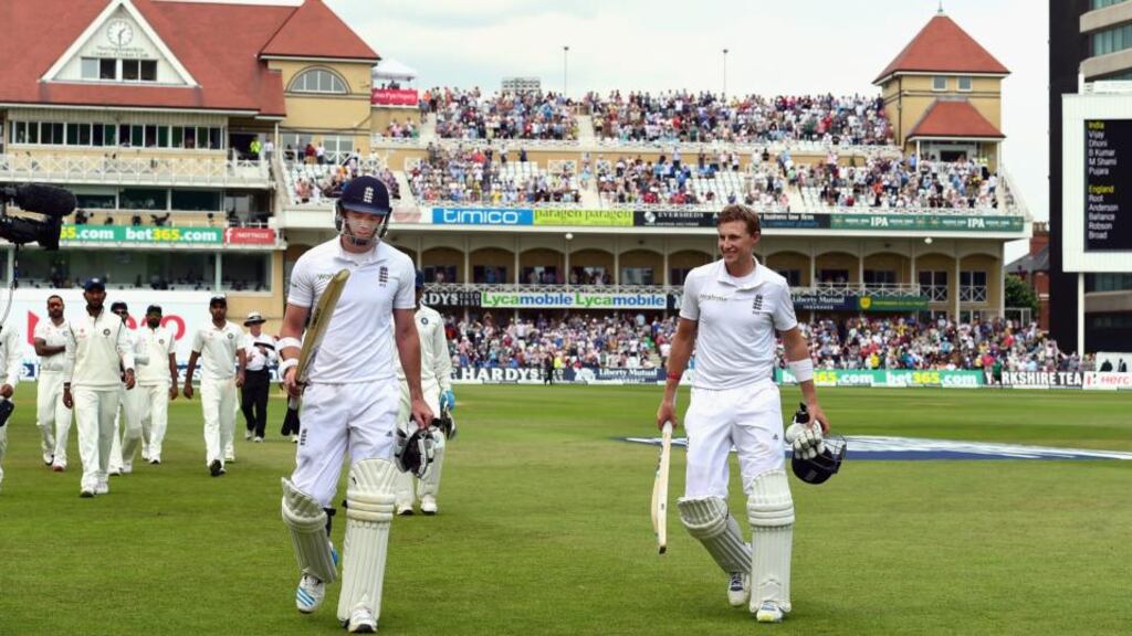 England batsman James Anderson and Joe Root leave the field at lunch on day four of the first Test at Trent Bridge after putting on an unbeaten 187 for the last wicket, a record in Test cricket. Photograph: Stu Forster/Getty Images