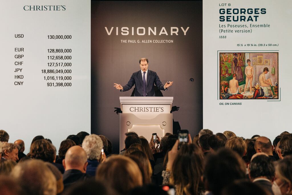 Georges Seurat’s Les Poseuses Ensemble (Petite version) (1888) is auctioned during the Paul Allen sale at Christie’s in Rockefeller Center in New York. Photograph: Jeenah Moon/The New York Times