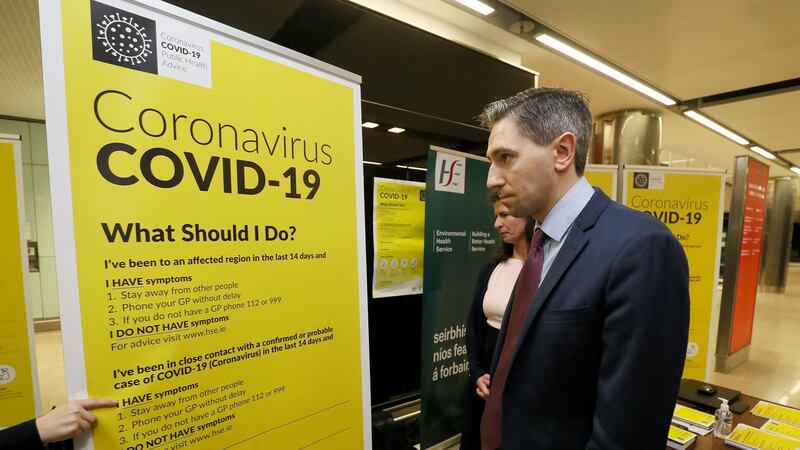 Minister for Health Simon Harris meets HSE staff manning the  public awareness campaign for coronavirus in the baggage hall of Terminal 2 at Dublin Airport.  Photograph: Brian Lawless/PA