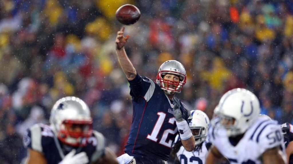 Tom Brady of the New England Patriots throws a touchdown pass to Rob Gronkowski (not pictured) during the AFC Championship Game against the Indianapolis Colts in Foxboro, Massachusetts on Sunday. Photograph: Jim Rogash/Getty Images