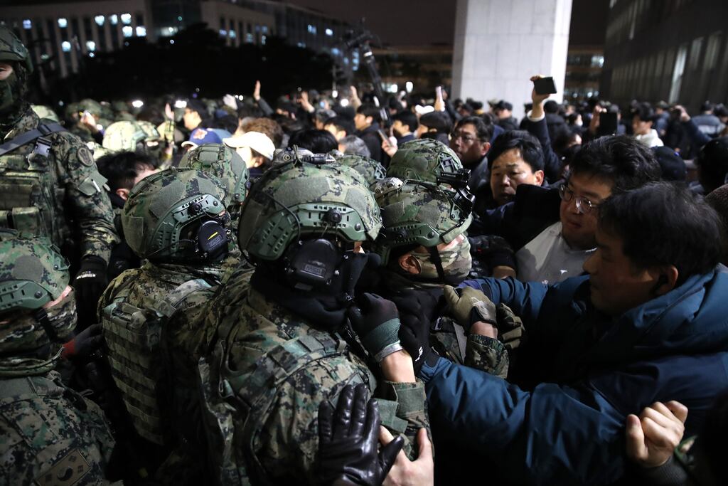 South Korean soldiers attempt to enter the National Assembly following the declaration of emergency martial law  by president Yoon Suk Yeol. Photograph: Chung Sung-Jun/Getty Images