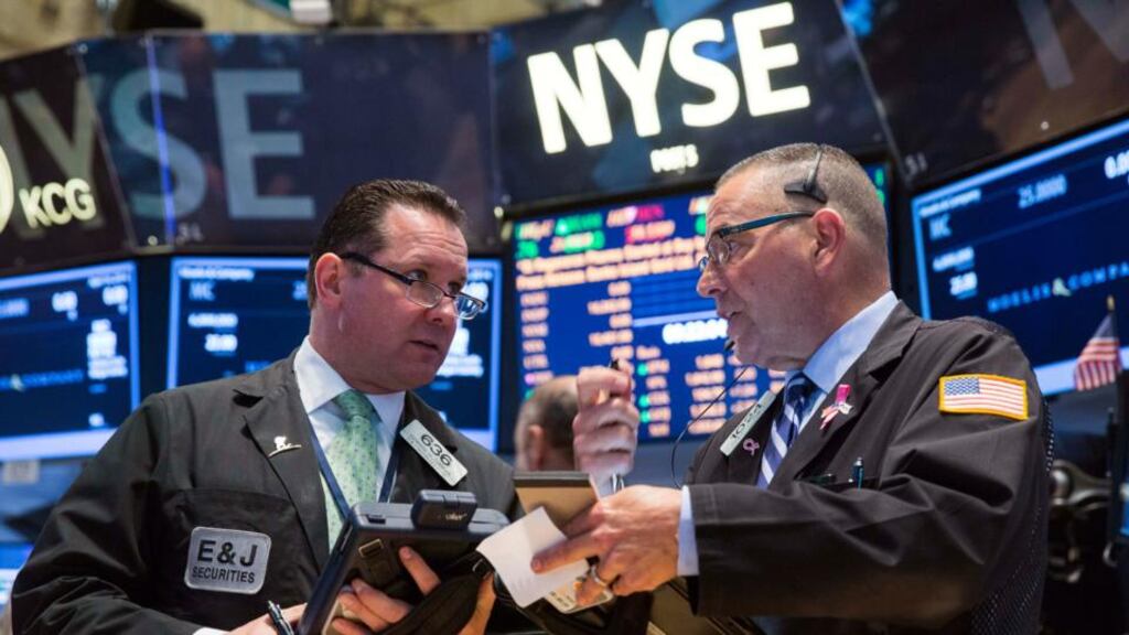 Traders work on the floor of the New York Stock Exchange: It’s something of a Wall Street ritual to lower estimates as the earnings season approaches, allowing companies to then beat expectations. Photograph: Lucas Jackson/reuters