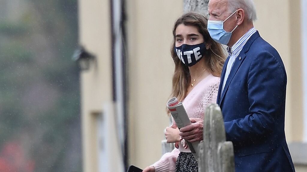 Democratic presidential nominee and former US vice-president Joe Biden leaves St Joseph on the Brandywine Roman Catholic Church with his granddaughter Finnegan Biden  after attending Sunday Mass in Wilmington, Delaware, on October 25th, 2020. Photograph: Angela Weiss/AFP/Getty