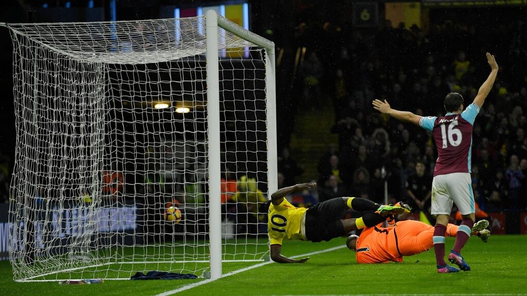 Watford’s Isaac Success shoots wide under pressure from West Ham United’s Darren Randolph late on. Photo: Toby Melville/Reuters