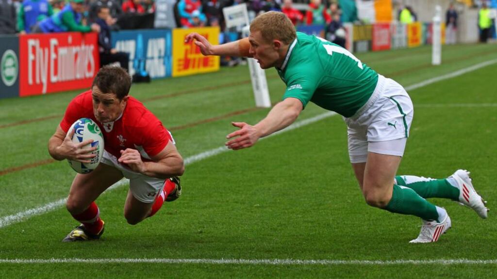 Shane Williams dives past Ireland’s Keith Earls to score a Welsh try during the 2011 Rugby World Cup quarter-final in New Zealand. Photograph: Alex Livesey/Getty.