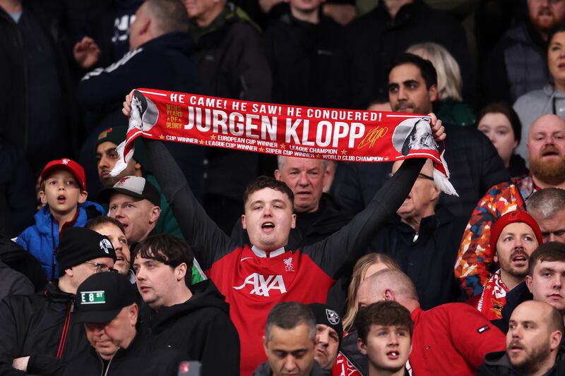 A Liverpool fan with Jürgen Klopp scarf at Anfield in April 2024. Photograph: Jan Kruger/Getty Images