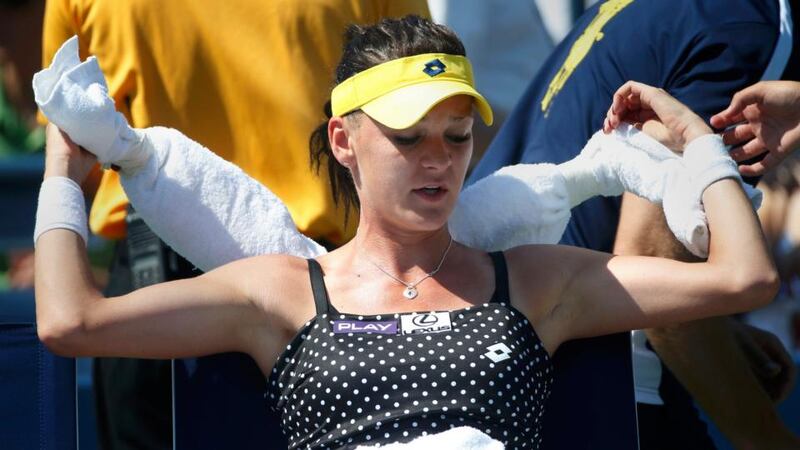 Agnieszka Radwanska of Poland uses ice bags wrapped in towels to keep cool during her match against Peng Shuai of China. Photograph: Mike Segar / Reuters