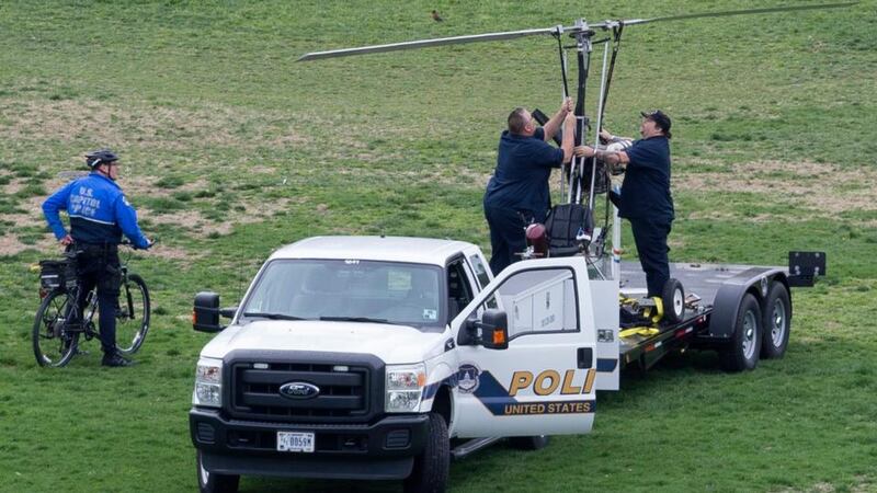 Authorities load the gyrocopter onto the back of a truck to remove it from the West Front of the US Capitol. Photograph: Michael Reynolds/EPA