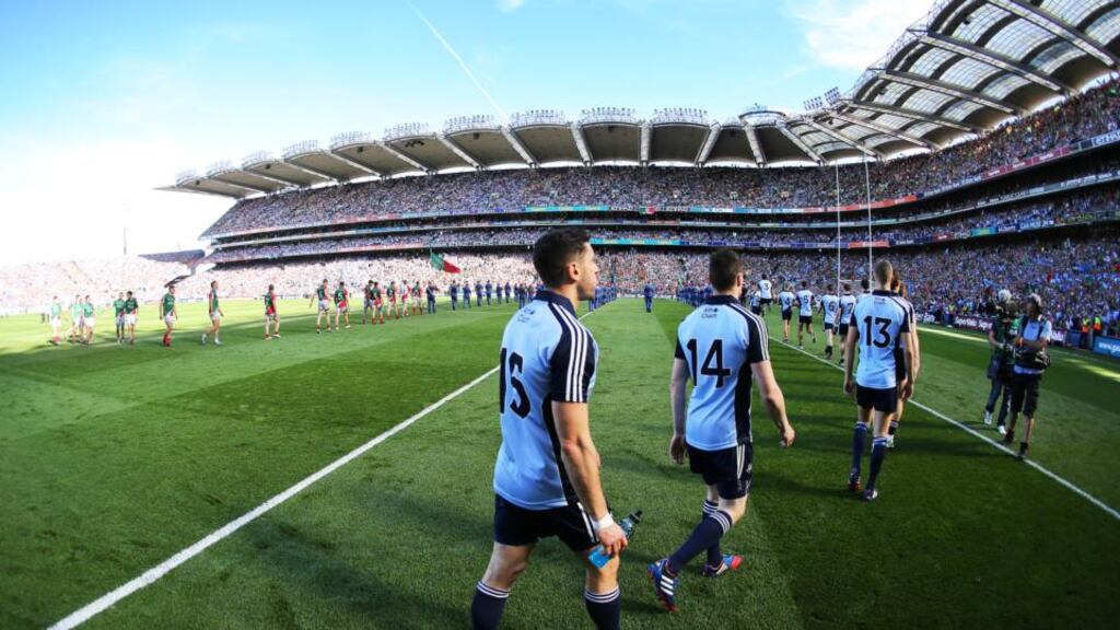 The Dublin and Mayo teams walk behind the band during the pre-match parade before the All-Ireland football final last September. Photo: Cathal Noonan/Inpho