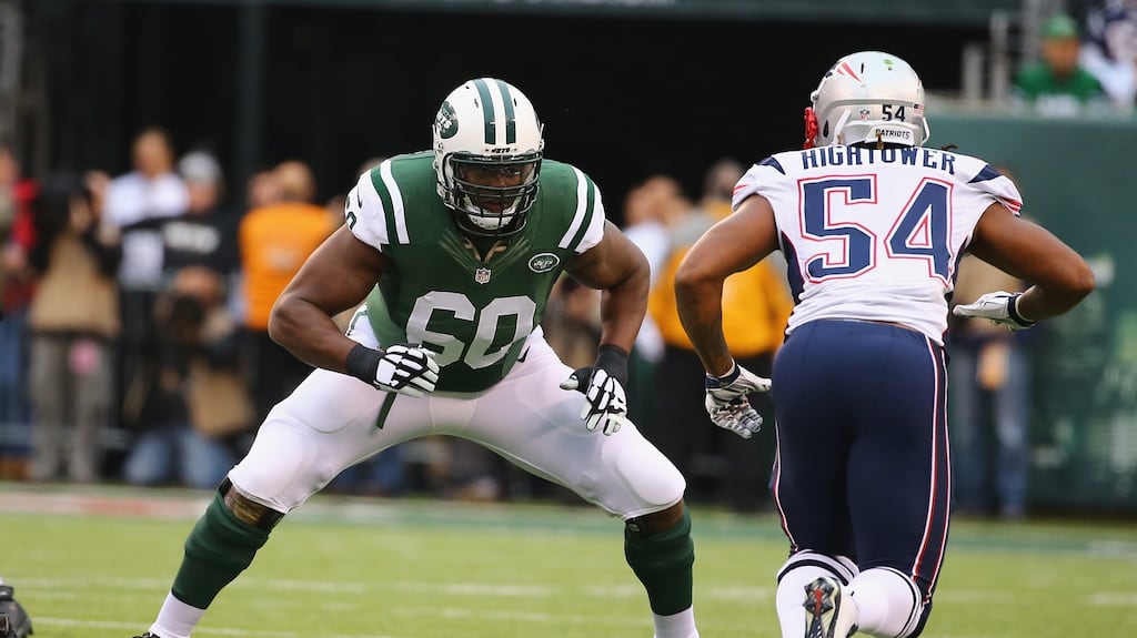 D’Brickashaw Ferguson (in green) of the New York Jets in action against the New England Patriots. Photograph: Al Bello/Getty Images