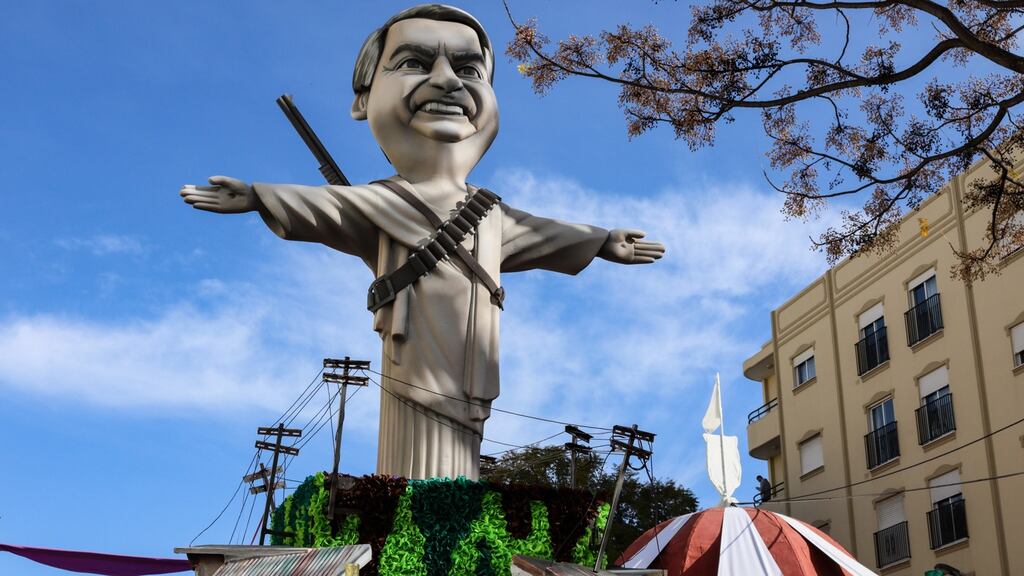 An effigy of Brazilian president Jair Bolsonaro traverses streets during the carnival procession in Loulé, Portugal. Photograph: Luis Forra/EPA