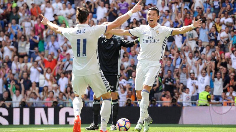 Cristiano Ronaldo celebrates with Real Madrid team-mate Gareth Bale after scoring opening goal during the La Liga match against Osasuna at Estadio Santiago Bernabeu in Madrid. Photograph: Denis Doyle/Getty Images