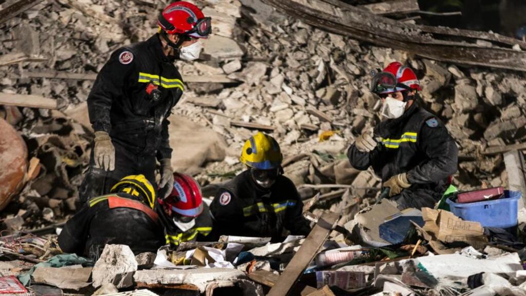 Rescue workers continue to remove rubble and debris in search for victims as they work at the site of a building collapse in Rosny sous Bois, near Paris. Photograph: Etienne Laurent/EPA