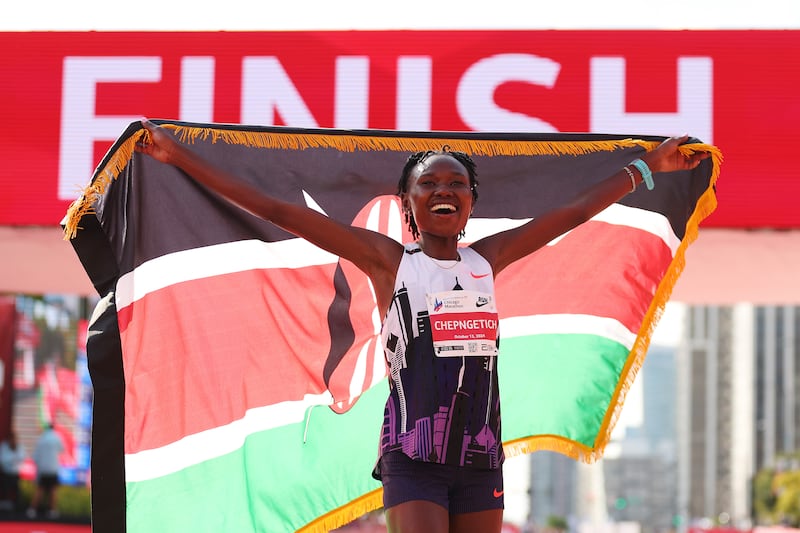 Ruth Chepngetich with the Kenyan flag. Photograph: Michael Reaves/Getty
