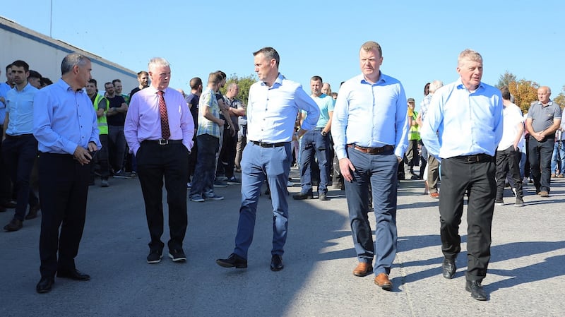 Liam McCaffrey, John ‘Bosco’ O’Hagan, Dara O’Reilly, John McCartin and Tony Lunney, brother of Kevin Lunney, lead the rally of support by the staff of Quinn Industrial Holdings in Derrylin on September 20th, a few days after the attack on Kevin Lunney. Photograph: Lorraine Teevan