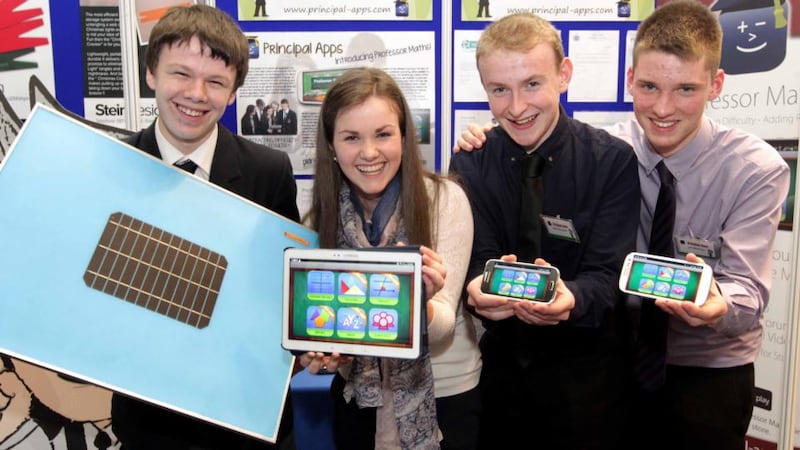 Joshua Dargan Hayes, from St Gerard’s College, Bray, Co Wicklow displays his Connect Shade product while Fiona Hogan, Ian Moloney and Maurice Lynch from Coláiste Chiaráin, Croom, Co Limerick, show their app Professor Maths