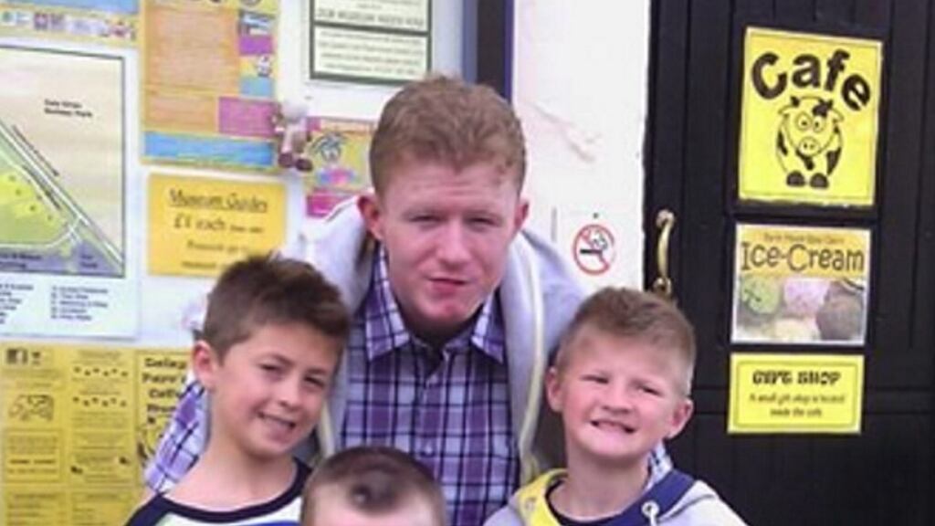 Jonathan O'Driscoll (22), at back, with his two younger twin brothers, Patrick and Tommy (9).