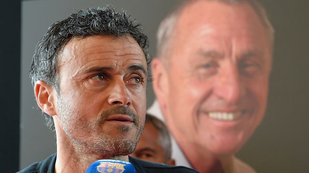 Barcelona's coach Luis Enrique speaks after paying tribute to late Dutch football star Johan Cruyff in a special condolence area set up at Camp Nou stadium, in Barcelona on March 29, 2016.Cruyff, one of the greatest footballers of all time who dazzled with his artistry, died on March 24, 2016 at the age of 68 after losing a battle with lung cancer, prompting an avalanche of tributes from around the sports world. / AFP PHOTO / LLUIS GENELLUIS GENE/AFP/Getty Images