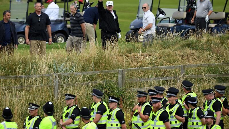 Donald Trump waves at protestors during his first official visit to the UK in Ju;y 2018. Photograph: Leon Neal/Getty