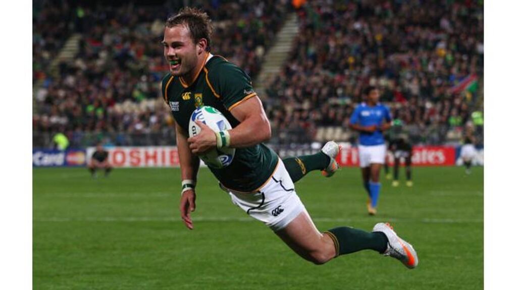 Francois Hougaard scores the Springboks 12th and final try against Namibia today. Photograph: Ryan Pierse/Getty Images