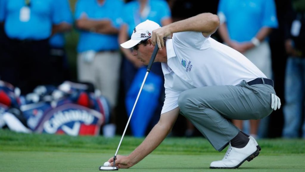 Nicolas Colsaerts of Belgium lines up a putt for a 59 on the 18th green at the Portugal Masters held at the Oceanico Victoria Golf Course. Photograph: Dean Mouhtaropoulos/Getty Images