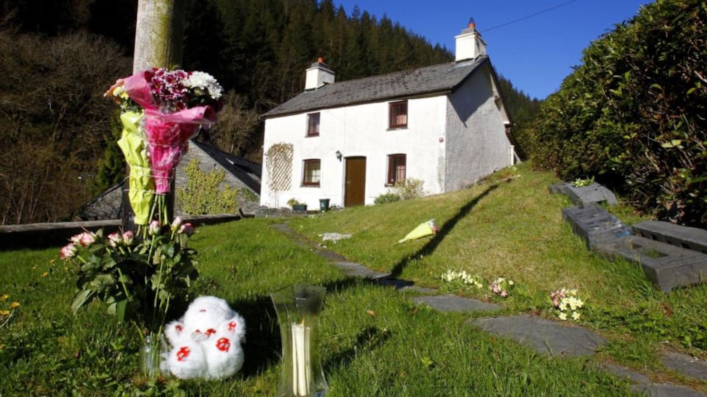 Floral tributes and a single candle burns outside the former home of Mark Bridger in Ceinws, Mid Wales who is on trial for the abduction and murder of April Jones. Photograph: Peter Byrne/PA Wire