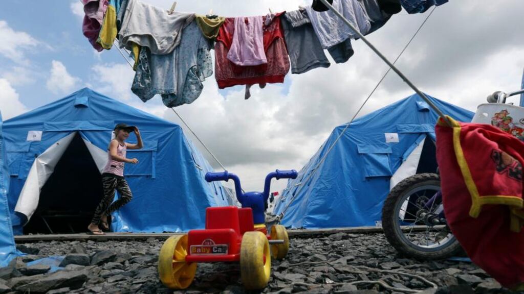 A girl plays in a temporary tent camp set up for Ukrainian refugees in the town of Novoshakhtinsk in the Rostov region near the Russian-Ukrainian border today. The Ukrainian government has floated the idea of a Marshall Plan for economic recovery. Photograph: Sergei Karpukhin/Reuters.
