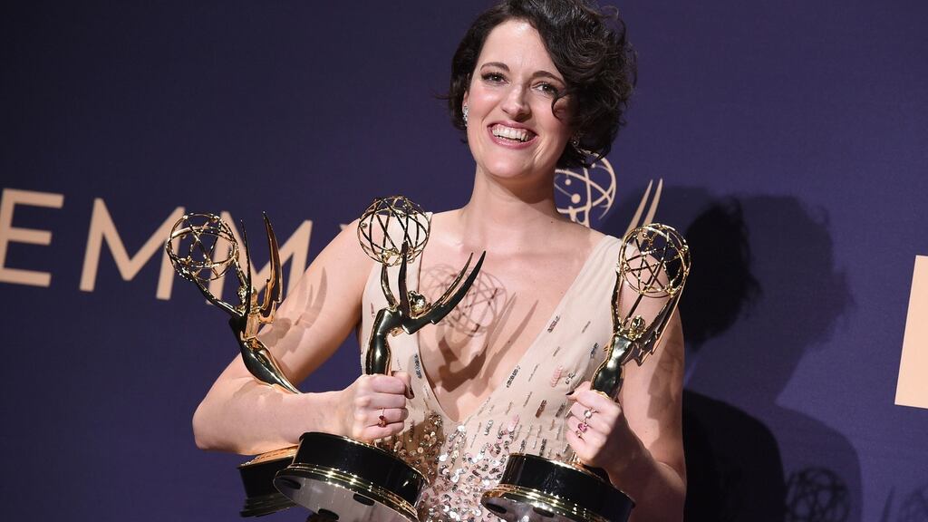 Phoebe Waller-Bridge with the three Emmys she won for her series Fleabag. Photograph: Jordan Strauss/Invision/AP