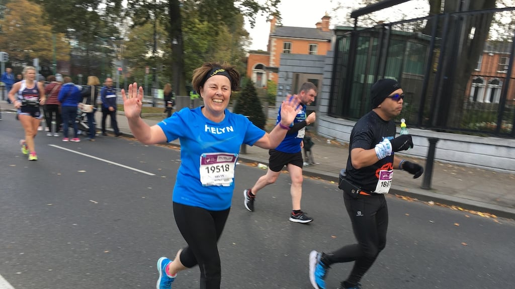 First-time marathoner Helyn Gilna recognises a familiar face at mile 25 of the Dublin City Marathon.