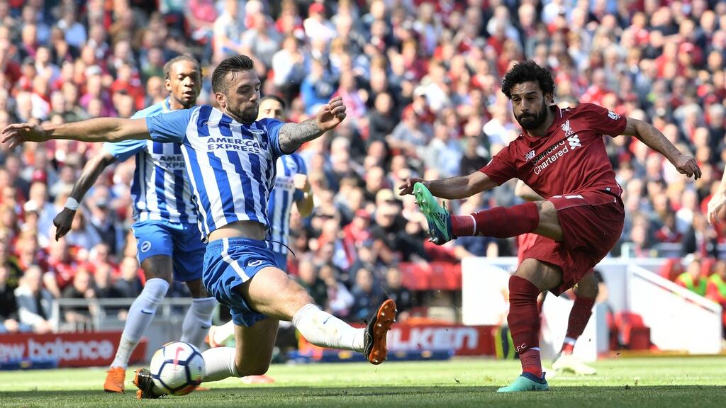 Mohamed Salah scores Liverpool’s opener against Brighton. Photograph: Michael Regan/Getty