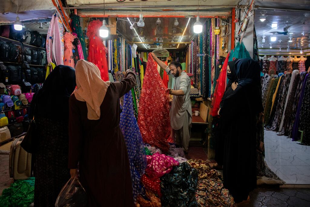 A fabric stall at a market in Kabul: In response to the Taliban takeover last August, the Department of Justice said Afghans already living in Ireland could apply for permission for up to four beneficiaries to join them in Ireland. Photograph: Kiana Hayeri/New York Times