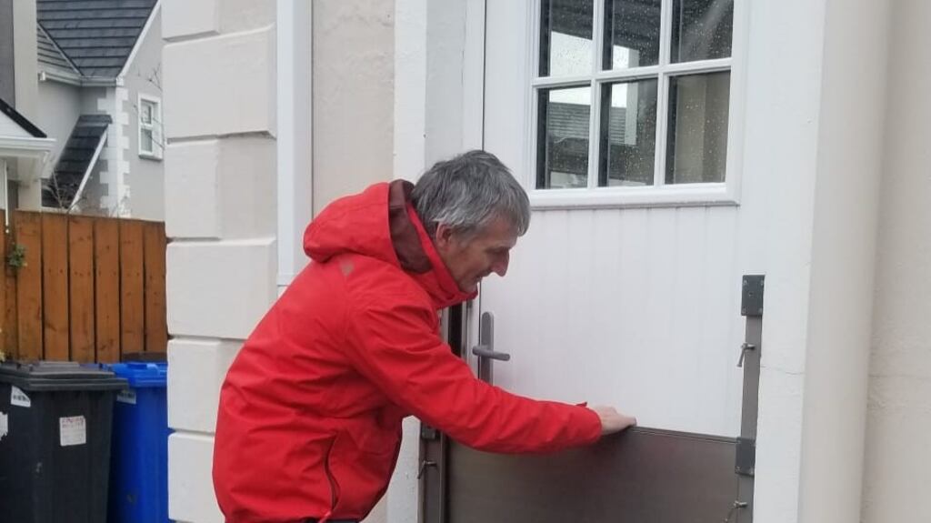 Paul Dunlop putting up a flood barrier at his home in Buncrana, Co Donegal, which is located in a flood-prone zone.