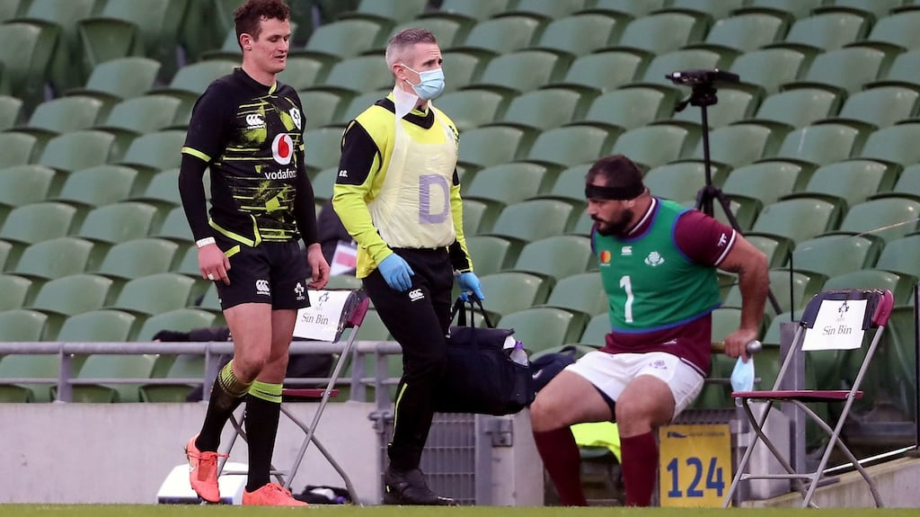 Ireland’s Billy Burns limps off injured during his side’s win over Georgia. Photograph: Niall Carson/PA