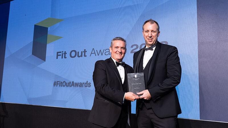 Niall Kearney, specification manager – Ireland at Zip Water, presents the fit out leader 2023 award to Ronan Holohan