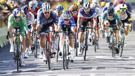 Jonas Vingegaard crashes but retains lead as Jasper Philipsen wins stage 15