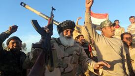 Gunmen kill 12 Islamic State fighters in eastern Syrian town