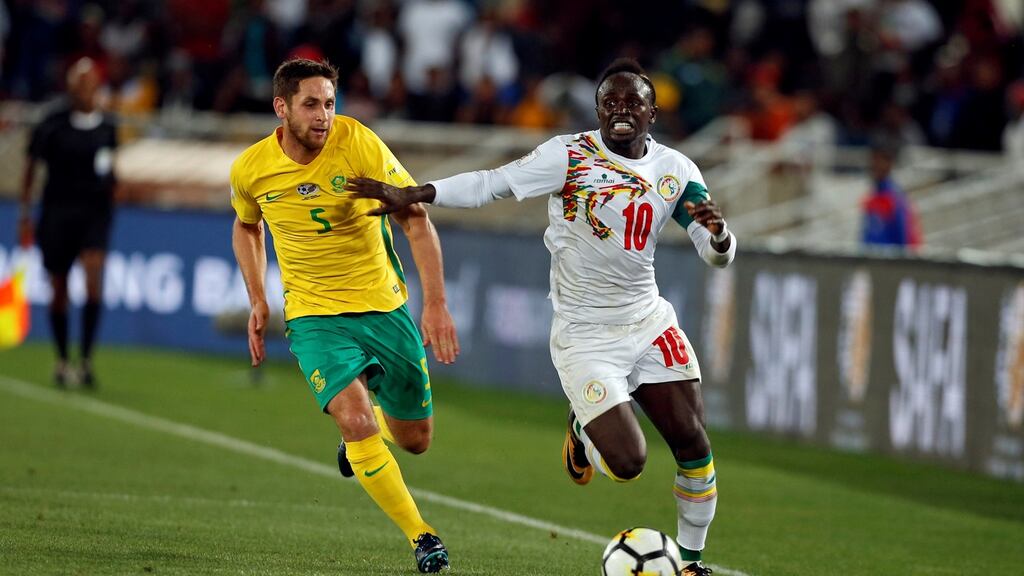 Senegal’s Sadio Mane in action with South Africa’s Dean Furman during the World Cup Qualifier at Peter Mokaba Stadium in Polokwane, South Africa. Photograph: Siphiwe Sibeko/Reuters