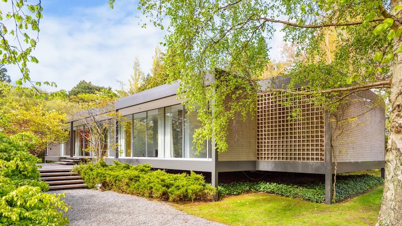 Path to steps, terrace and entrance along south side.