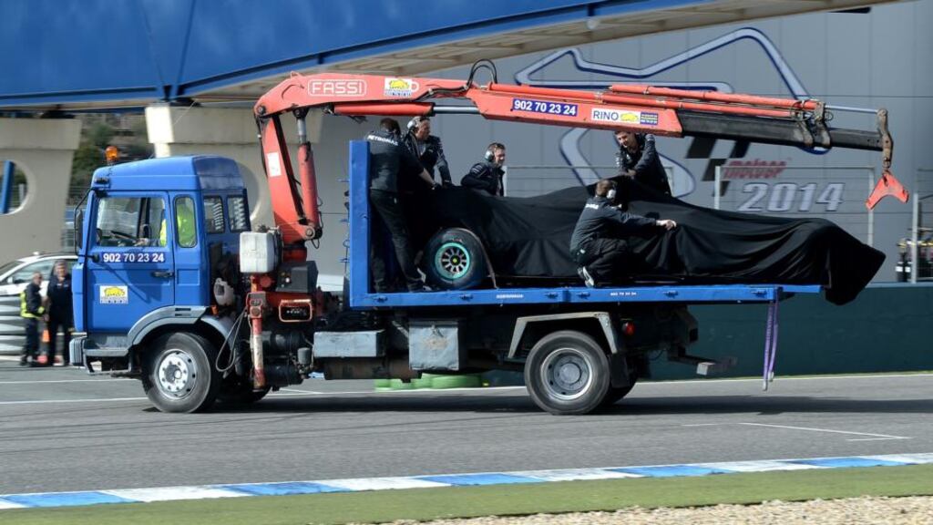 The Mercedes of Lewis Hamilton is removed from the track after a crash during testing in Jerez. Photograph: Martin Rickett/PA Wire.