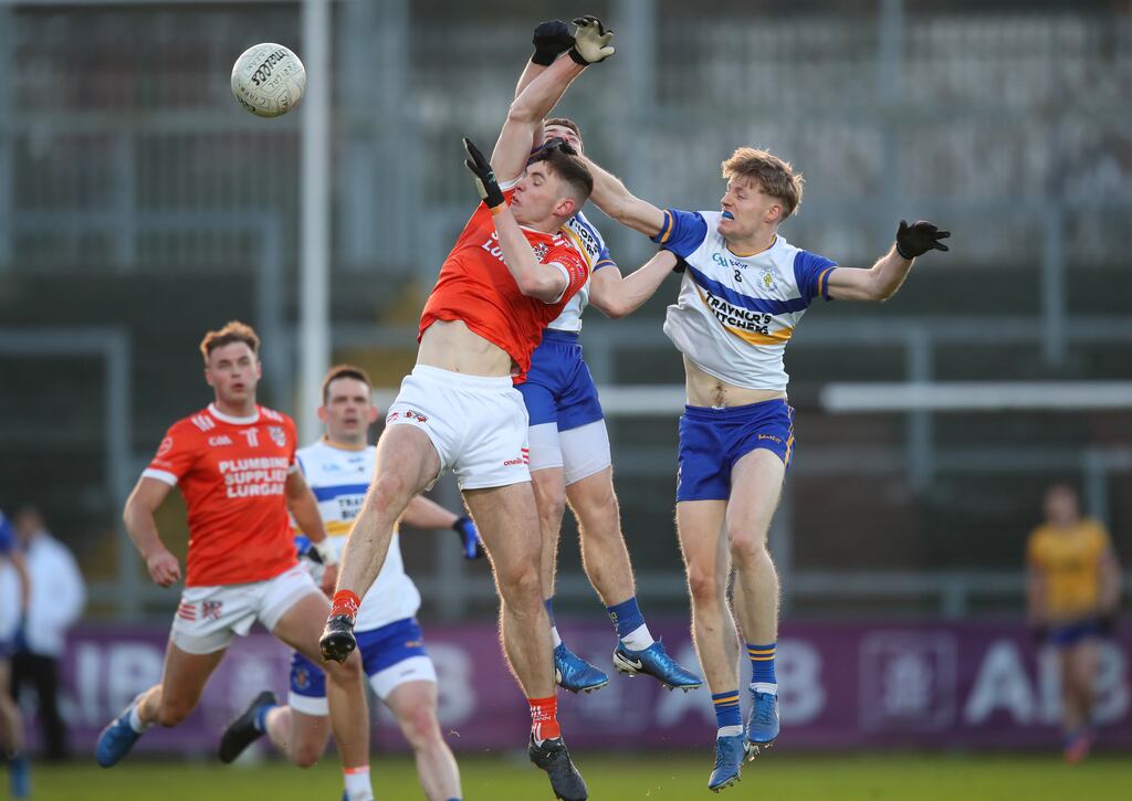 Errigal Ciaran's Padraig McGirr and Ciaran McGinley challenge Daniel Magee of Clann Eireann for a high ball. Photograph: Leah Scholes/Inpho